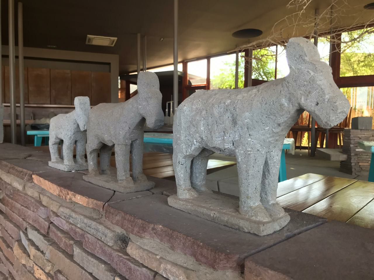 Artisan craftwork of three donkeys made from volcanic rock in Atacama.